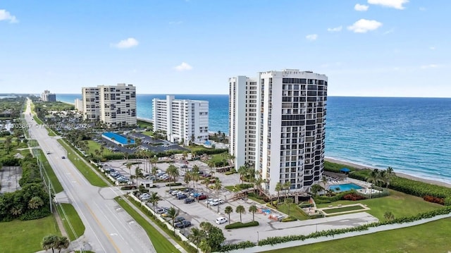 aerial view featuring a water view and a beach view