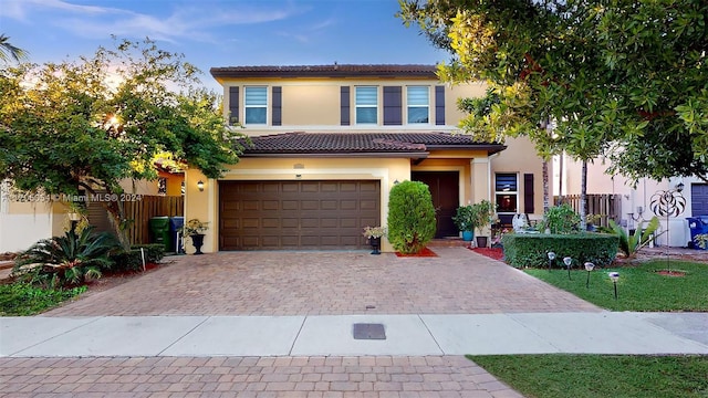 mediterranean / spanish-style house featuring a garage