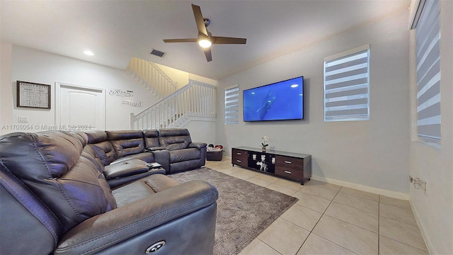 tiled living room with ceiling fan