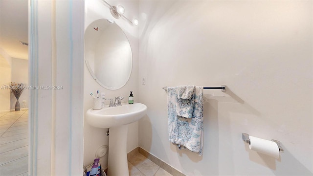 bathroom with tile patterned floors and sink