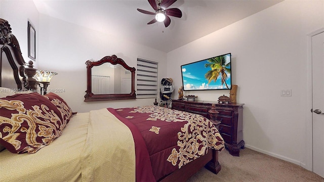 carpeted bedroom with ceiling fan and lofted ceiling