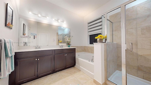 bathroom with tile patterned floors, vanity, and plus walk in shower