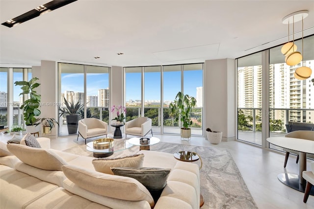 living room featuring a wealth of natural light and floor to ceiling windows