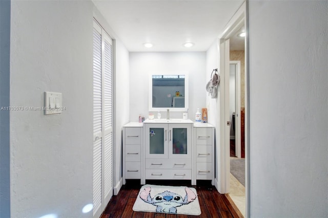 bathroom with hardwood / wood-style flooring and vanity