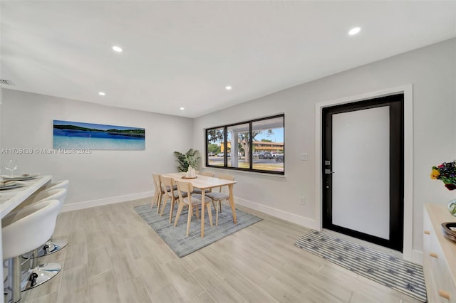 dining room with light wood-type flooring