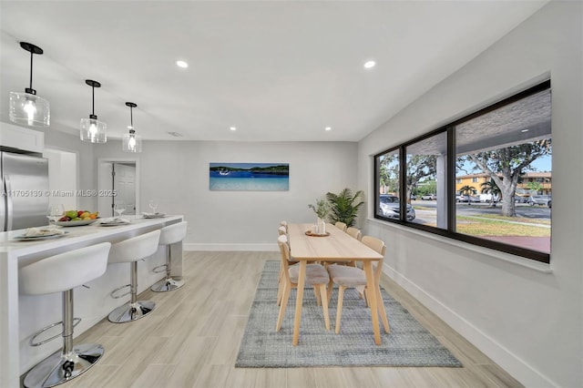 dining room with light hardwood / wood-style flooring