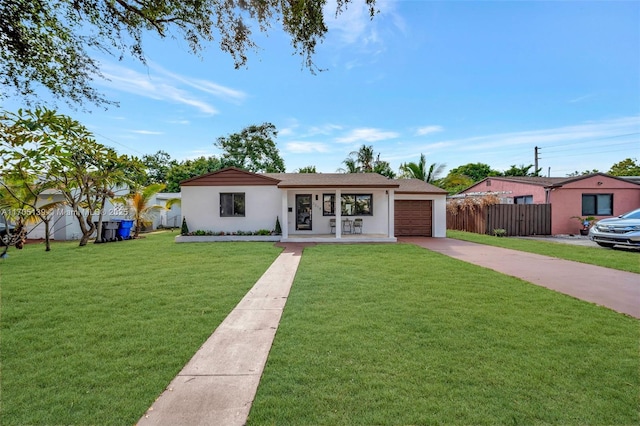 single story home featuring a garage and a front yard