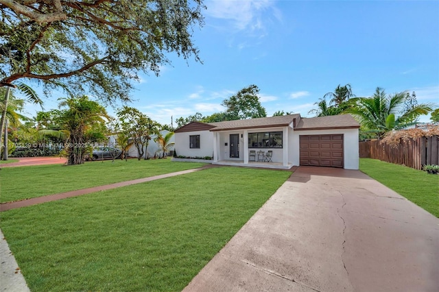 ranch-style house with a garage and a front yard