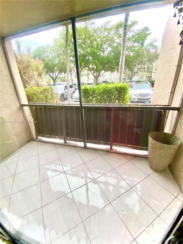 unfurnished sunroom featuring plenty of natural light