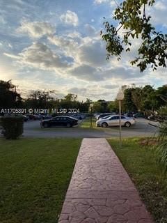 view of home's community with a lawn