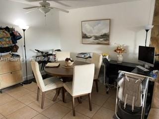 tiled dining area with ceiling fan