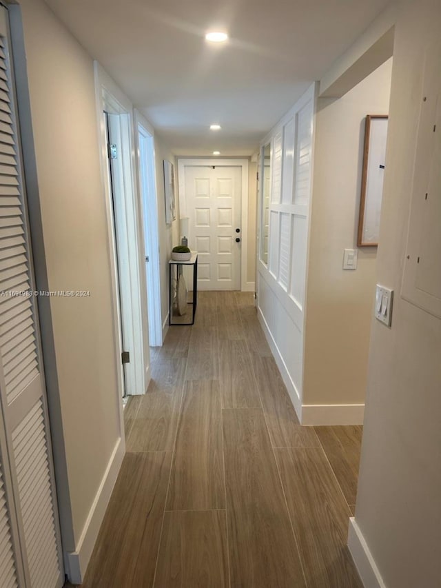 hallway featuring wood-type flooring