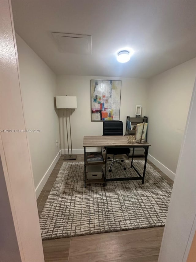 office area featuring dark wood-type flooring