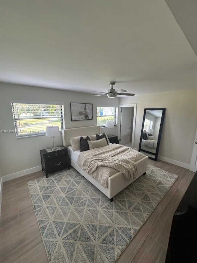 bedroom featuring ceiling fan and wood-type flooring