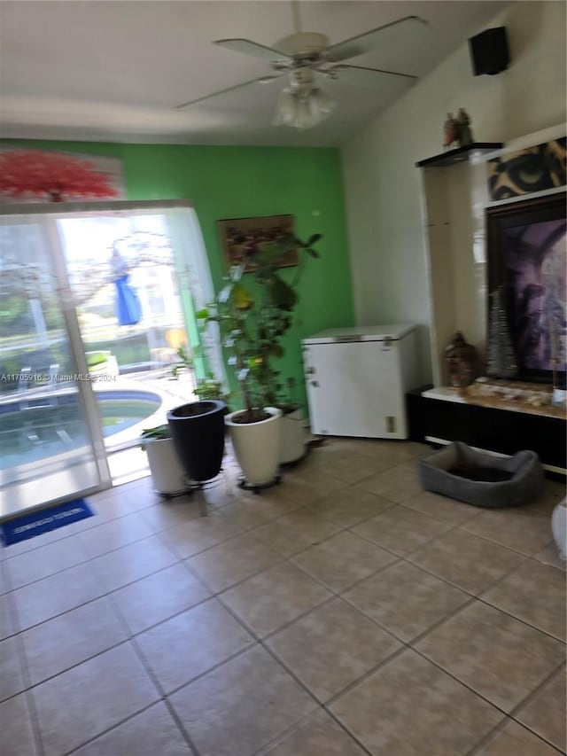 interior space featuring ceiling fan