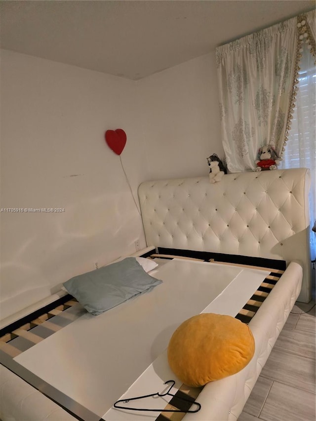 bedroom featuring light hardwood / wood-style floors