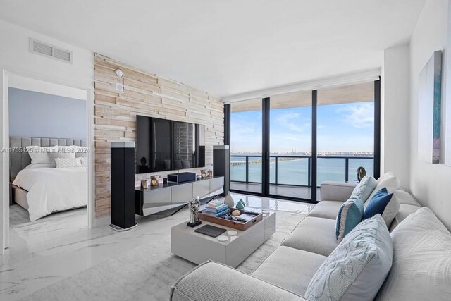 460 NE 28th St Unit 3205, Miami, FL 33137 - living room with a wall of windows and marble tiled flooring