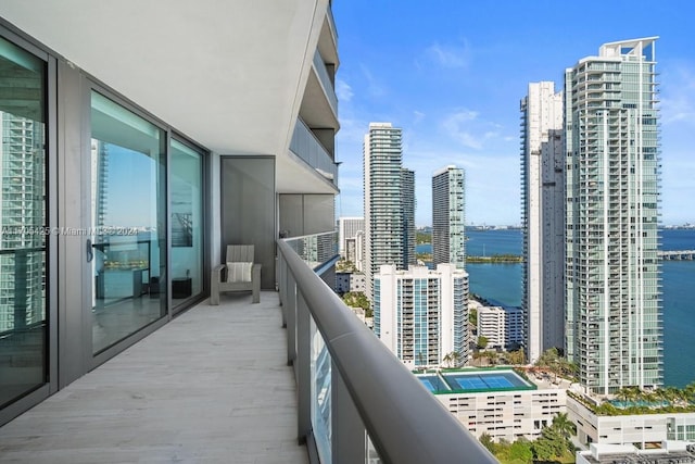 balcony featuring a water view