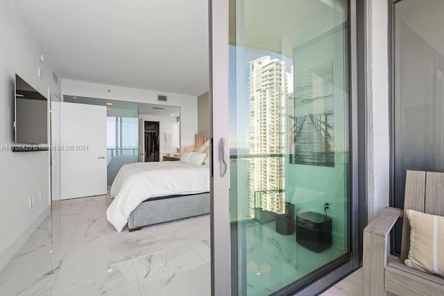 460 NE 28th St Unit 3205, Miami, FL 33137 - bedroom featuring marble look tiles and a spacious closet