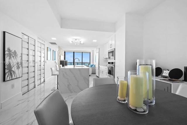460 NE 28th St Unit 3205, Miami, FL 33137 - dining room featuring light marble finish flooring