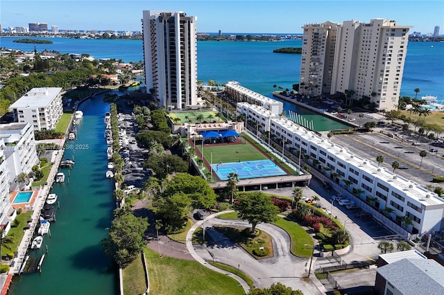 birds eye view of property with a water view