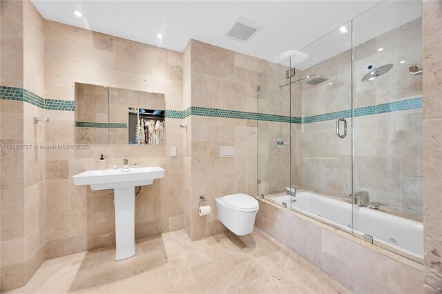 1800 NE 114th St Unit Ph05, Miami, FL 33181 - bathroom with toilet, shower / bath combination with glass door, and tile walls