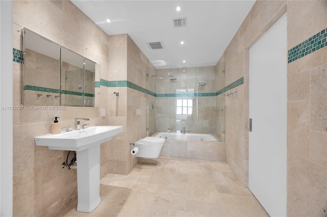 1800 NE 114th St Unit Ph05, Miami, FL 33181 - bathroom featuring tile walls, tiled shower / bath combo, and toilet