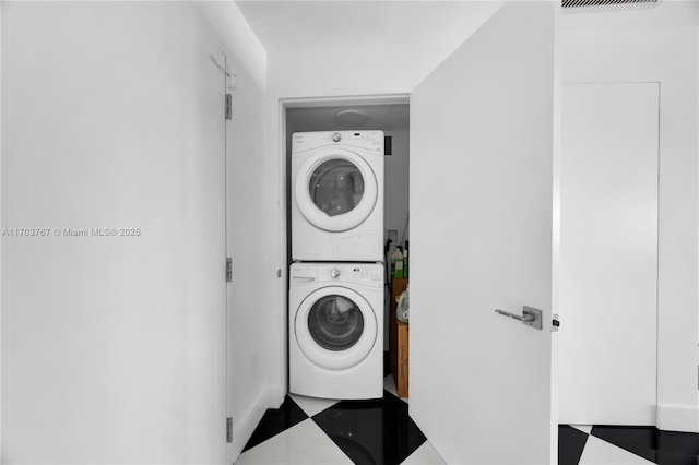 1800 NE 114th St Unit Ph05, Miami, FL 33181 - washroom featuring stacked washer / dryer