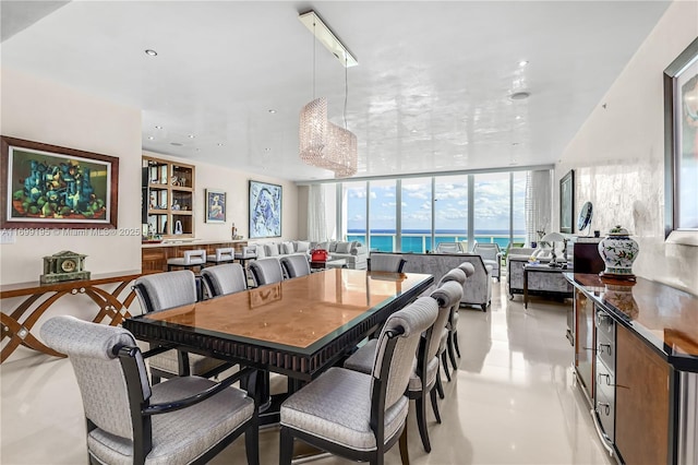 dining room featuring floor to ceiling windows and recessed lighting