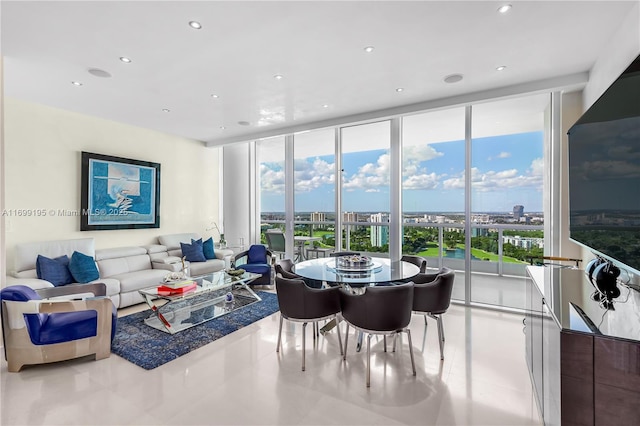 dining space featuring a wall of windows and recessed lighting