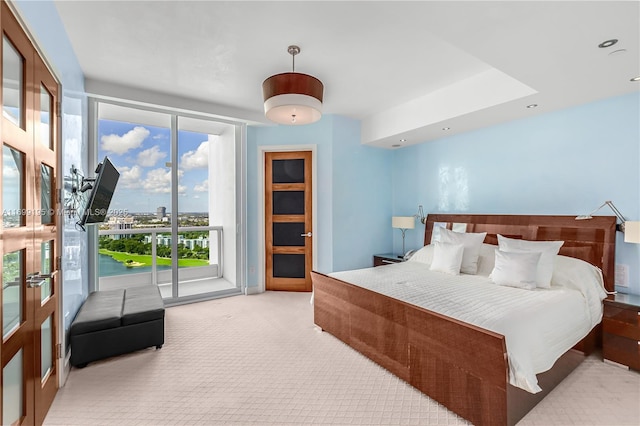 bedroom featuring access to exterior, carpet flooring, and recessed lighting
