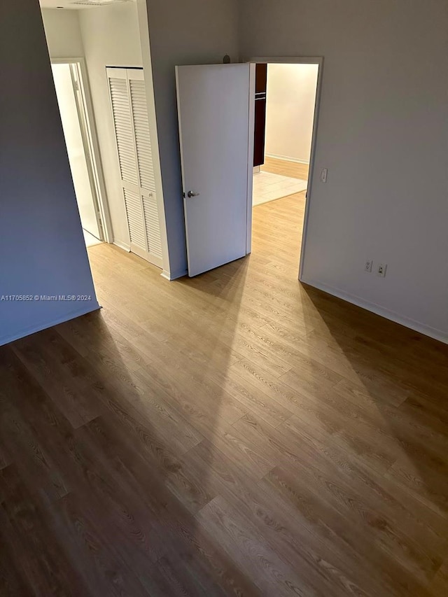 spare room featuring light wood-type flooring