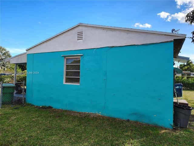 view of home's exterior with a lawn