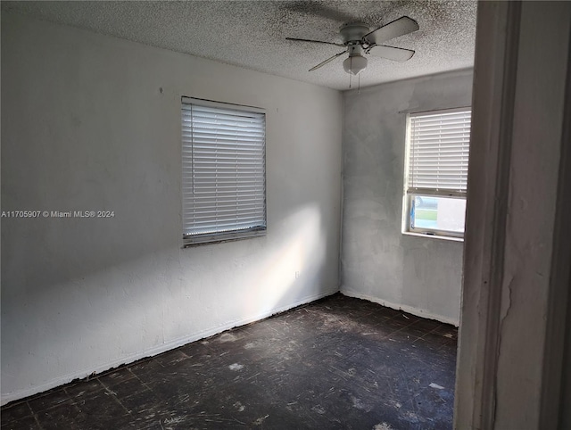 unfurnished room featuring a textured ceiling and ceiling fan