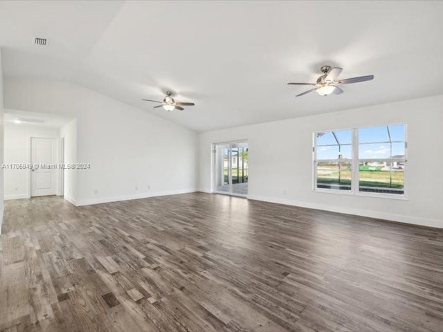 unfurnished living room featuring ceiling fan, dark wood-type flooring, and lofted ceiling