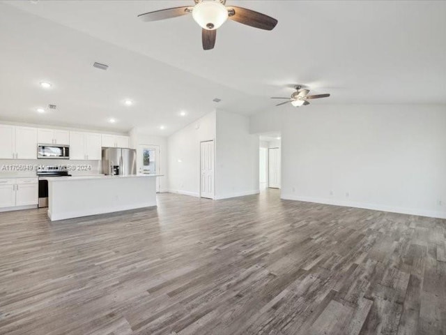 unfurnished living room featuring lofted ceiling, ceiling fan, and wood-type flooring