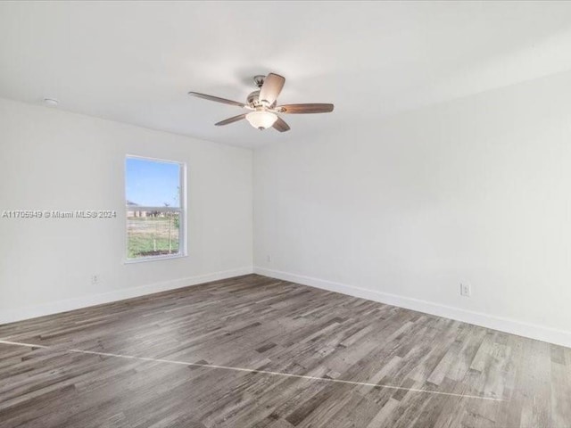 unfurnished room featuring ceiling fan and wood-type flooring