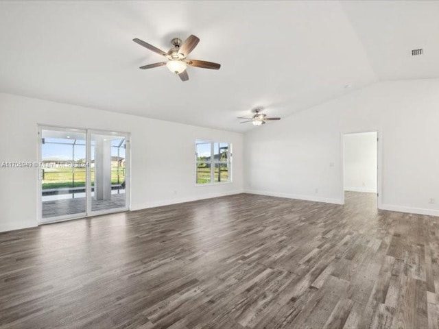 unfurnished room with dark hardwood / wood-style flooring, vaulted ceiling, and ceiling fan