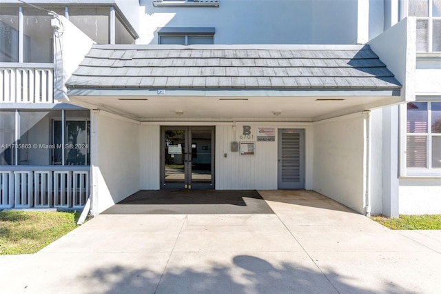 property entrance featuring french doors