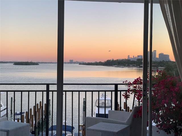 balcony at dusk with a water view