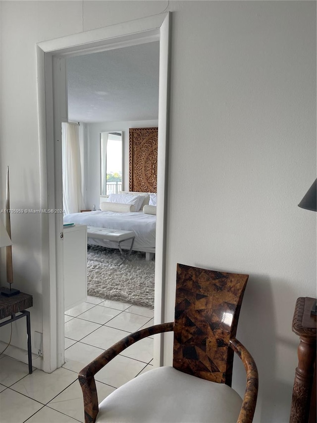 bedroom with light tile patterned floors