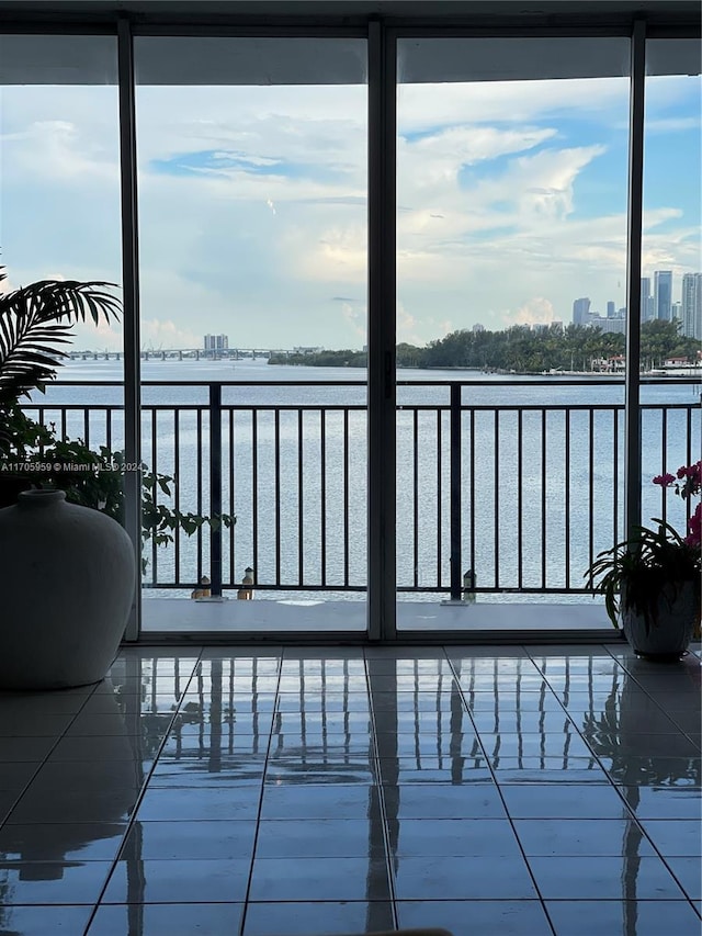 wooden deck featuring a water view