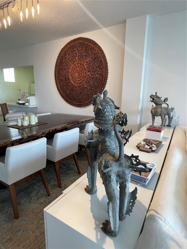 dining room with a textured ceiling