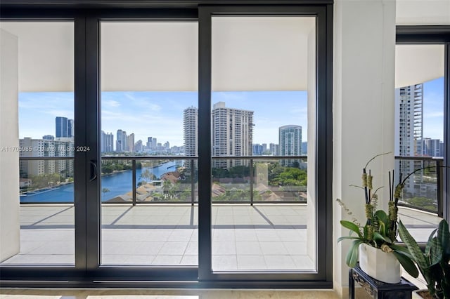 doorway to outside featuring a water view