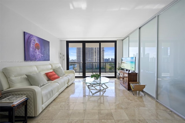 living room featuring a wall of windows