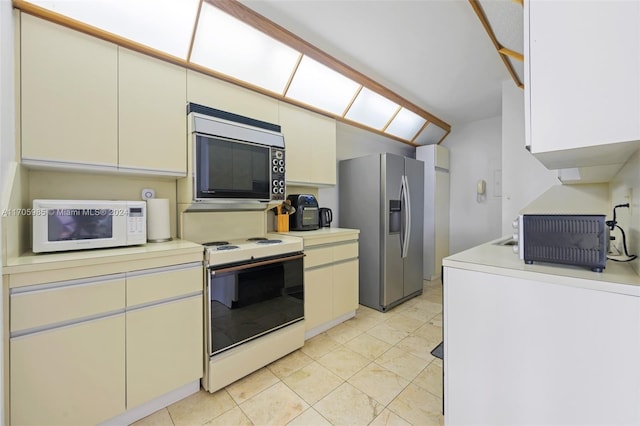 kitchen with white cabinetry and appliances with stainless steel finishes