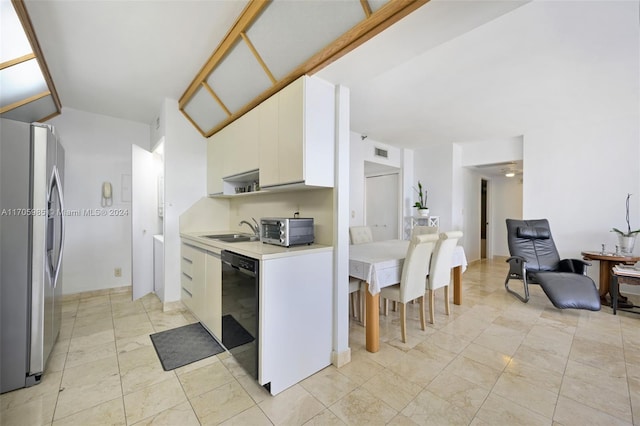 kitchen featuring dishwasher, sink, white cabinetry, and stainless steel refrigerator with ice dispenser