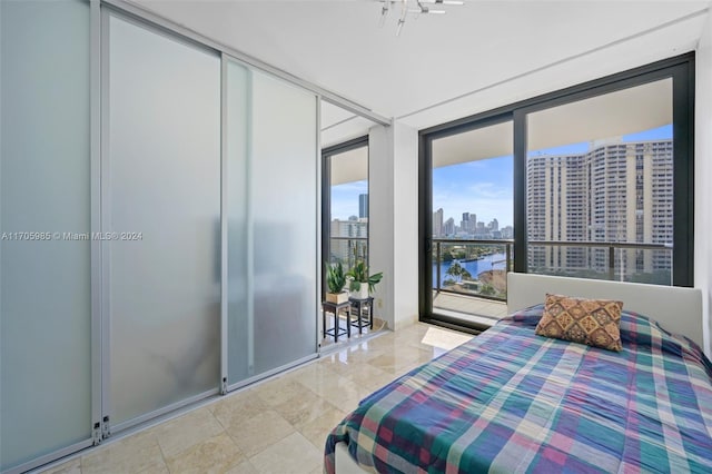 bedroom featuring a wall of windows