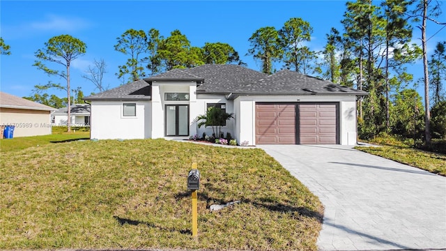 view of front facade featuring a front yard and a garage