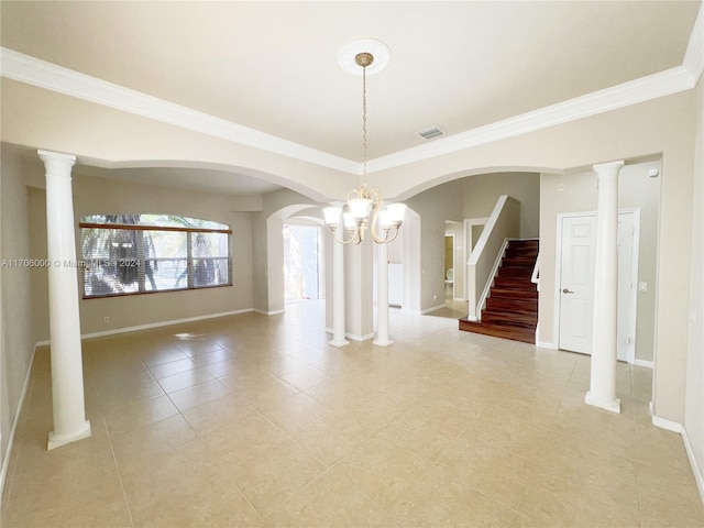 empty room with a notable chandelier, ornamental molding, and light tile patterned floors